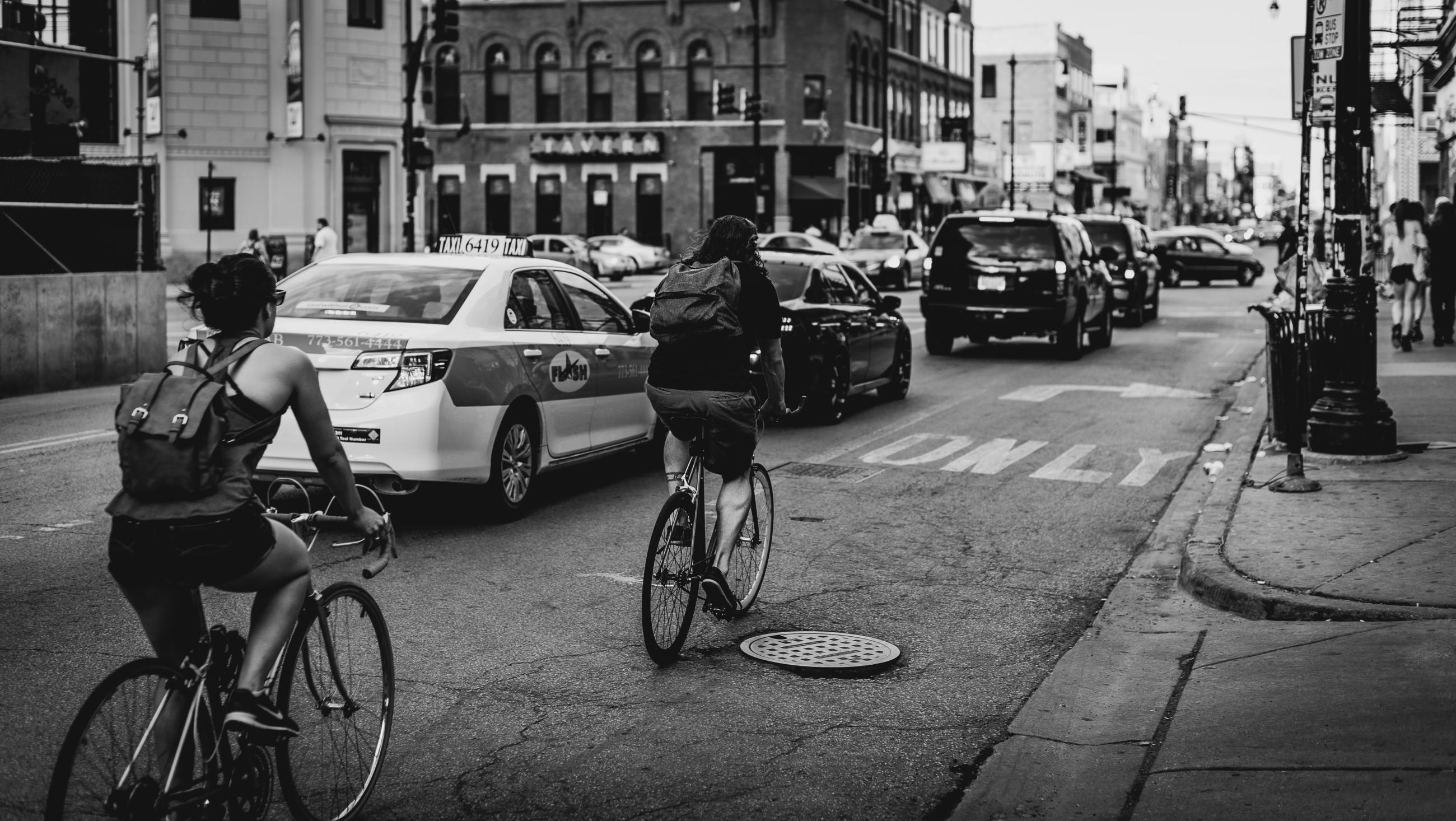 cyclists in traffic in  a city environment