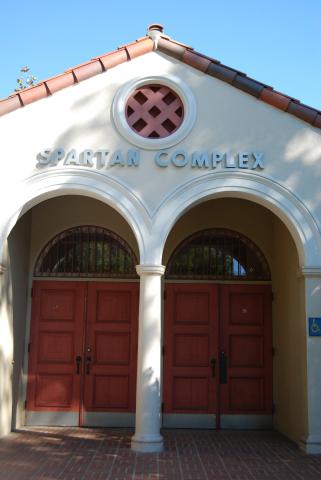 An image of a white building with the words "Spartan Complex" on it