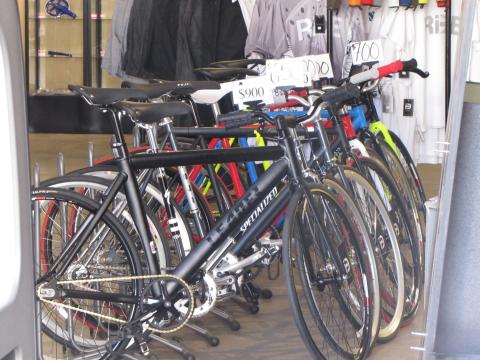 A picture of a lineup of fixed gear bicycles that are for sale.